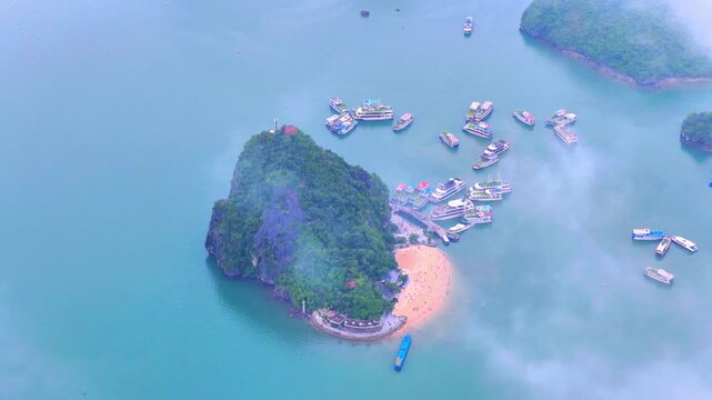 Aerial view of Ha Long Bay, Vietnam with cruise ships, islands among limestone islands. UNESCO World Heritage Site. Popular landmark, famous destination of Vietnam