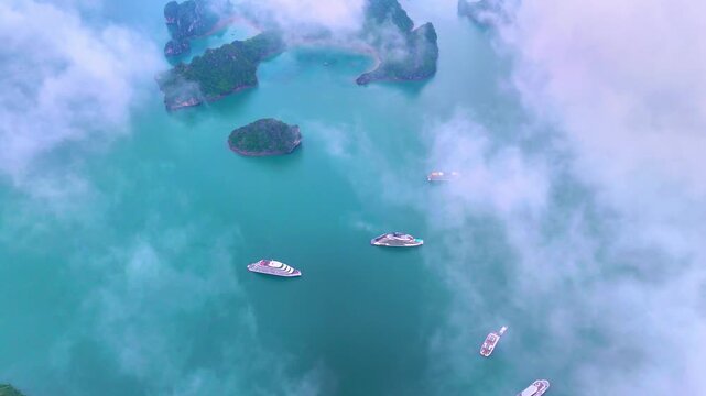 Aerial view of Ha Long Bay, Vietnam with cruise ships, islands among limestone islands. UNESCO World Heritage Site. Popular landmark, famous destination of Vietnam
