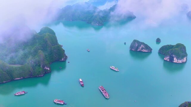 Aerial view of Ha Long Bay, Vietnam with cruise ships, islands among limestone islands. UNESCO World Heritage Site. Popular landmark, famous destination of Vietnam