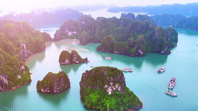 Aerial view of Ha Long Bay, Vietnam with cruise ships, islands among limestone islands. UNESCO World Heritage Site. Popular landmark, famous destination of Vietnam