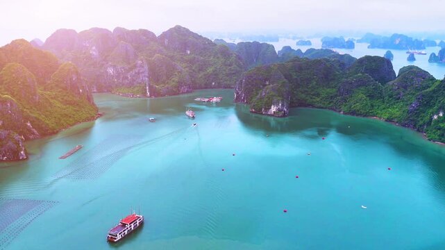Aerial view of Ha Long Bay, Vietnam with cruise ships, islands among limestone islands. UNESCO World Heritage Site. Popular landmark, famous destination of Vietnam