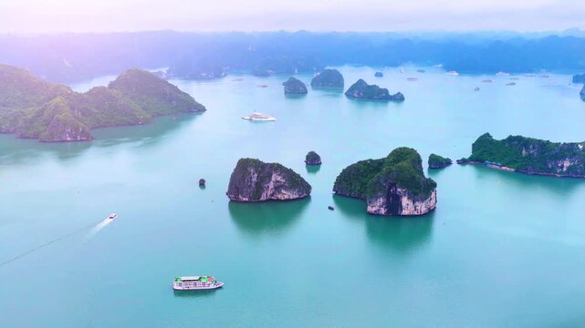 Aerial view of Ha Long Bay, Vietnam with cruise ships, islands among limestone islands. UNESCO World Heritage Site. Popular landmark, famous destination of Vietnam