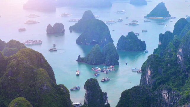 Aerial view of Ha Long Bay, Vietnam with cruise ships, islands among limestone islands. UNESCO World Heritage Site. Popular landmark, famous destination of Vietnam