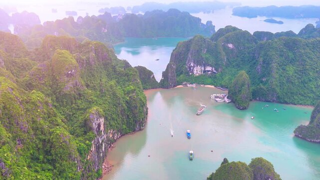 Aerial view of Ha Long Bay, Vietnam with cruise ships, islands among limestone islands. UNESCO World Heritage Site. Popular landmark, famous destination of Vietnam