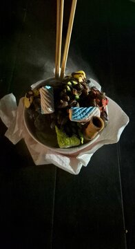 A liquid nitrogen-infused dessert, commonly referred to as smoky ice cream or a "Dragon's Breath" treat.