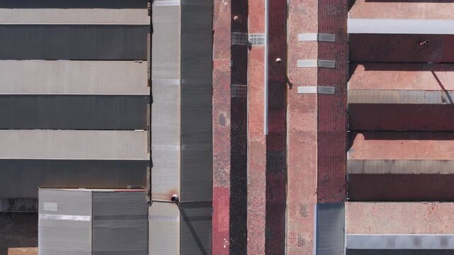 Scoresby, Victoria, Australia - 13 September 2026: Aerial view of PGH Bricks Pavers Selection Centre featuring textured brick walls and industrial metal cladding under bright daylight.