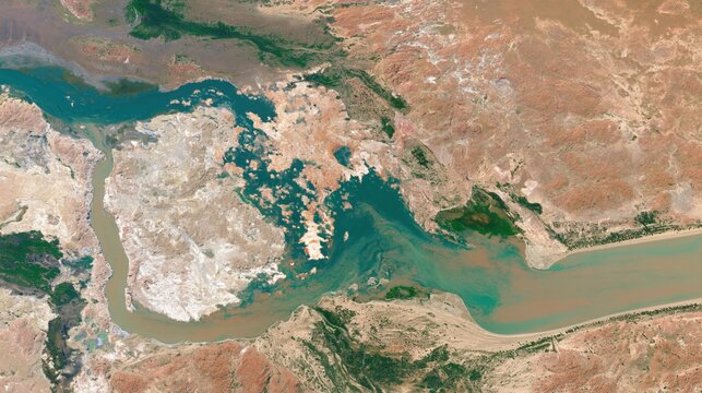 Aerial view of a river delta and arid landscape