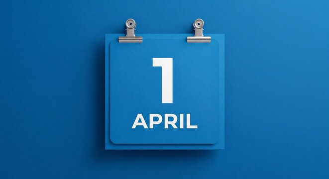 A blue wall calendar page showing the date of the first of april hanging with april mounted matching two metallic clips square blue monochromatic