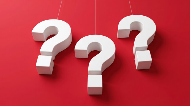 Three white three dimensional question marks hanging on thin wires against vibrant red background represent mystery and decision making.