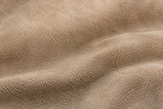 Warm beige suede with directional soft nap texture