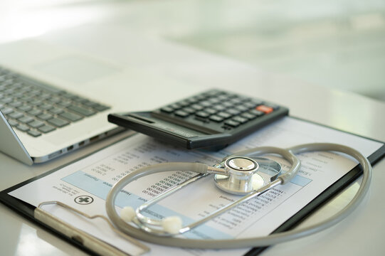 medical billing and stethoscope, calculator. medical treatment expense plan and health insurance concept.