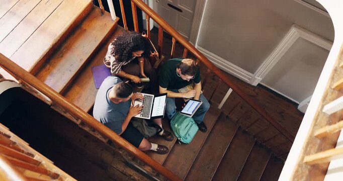 People, stairs and college students with technology for study, group assignment or research. Above, man and women at university with laptop, tablet and books for discussion, thesis or education