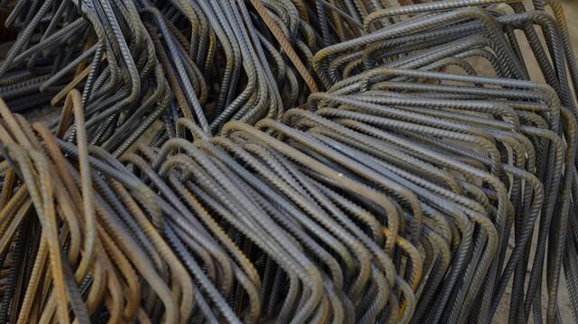 Macro perspective highlights rough textures and metallic surfaces. Organized chaos describes collection of construction materials