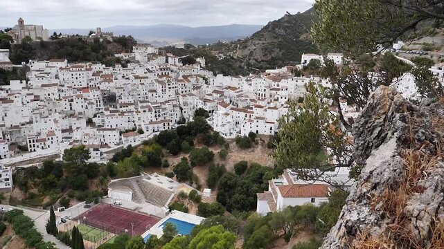 aerial view of whitewashed andalusian village on hillside, pueblo blanco in spain