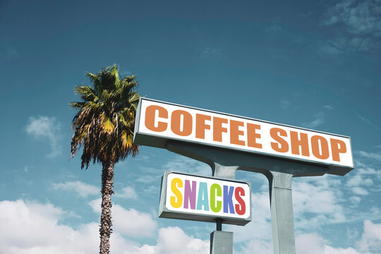 Aged retro coffee shop and snack sign with palm tree