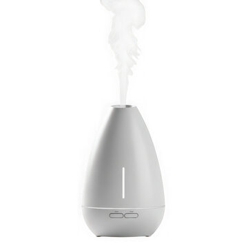 Modern ultrasonic aroma essential oil diffuser emitting cool white mist on white background