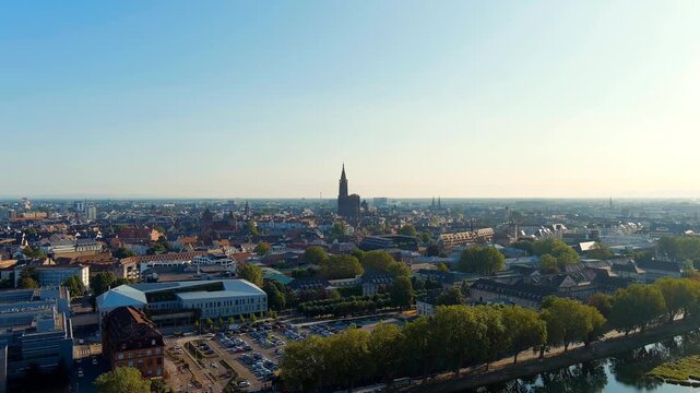 Strasbourg, France. Notre-Dame Cathedral, its solitary Gothic spire rising 142 metres above the Alsace plain, panoramic Drone footage on a clear summer morning. Drone footage