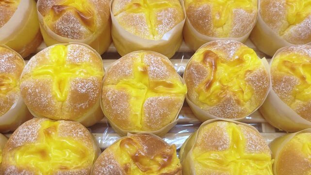 Assortment of baked pastries and buns at the bakery store.