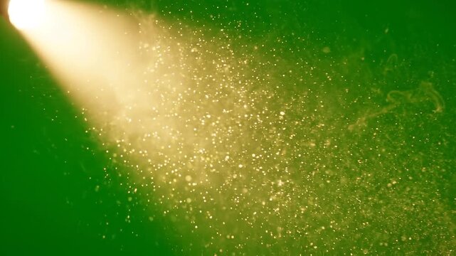 Golden light beam with floating dust particles. Warm sun ray spotlight effect on green screen background. Dramatic glowing overlay element