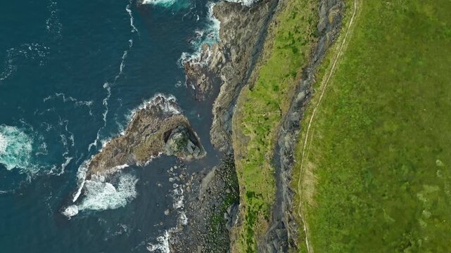 Atlantic Ocean Cliffs of Moher Ireland aerial view captures breathtaking natural scenery with rugged rocks and waves along a famous European travel destination