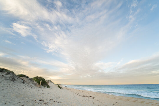 Sandy path leading through coastal dunes to ocean at Scarborough Beach, Perth, Western Australia