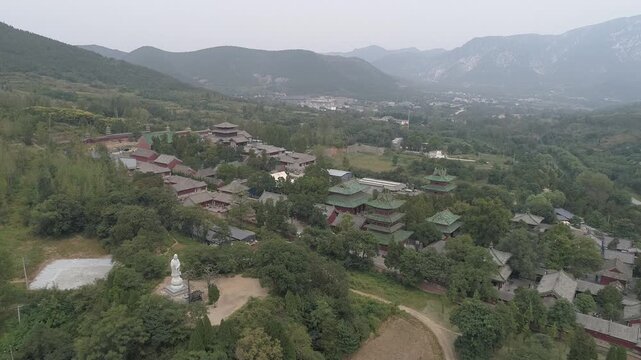 Raw footage of Aerial drone view of  Shaolin temple in Henan Province, China, Asia. Pagoda Forest at Shaolin Temple in China Asia. Shaolin Monastery from drone.