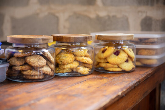 biscuits in glass jars on wooden bench