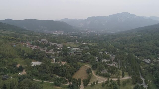 Raw footage of Aerial drone view of  Shaolin temple in Henan Province, China, Asia. Pagoda Forest at Shaolin Temple in China Asia. Shaolin Monastery from drone.