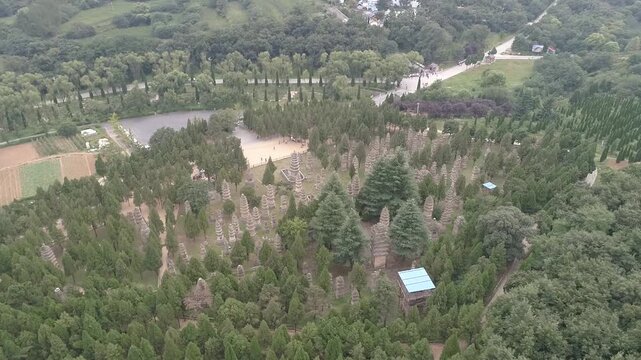 Raw footage of Aerial drone view of  Shaolin temple in Henan Province, China, Asia. Pagoda Forest at Shaolin Temple in China Asia. Shaolin Monastery from drone.