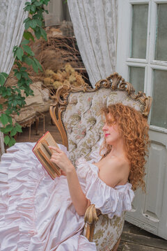 Romantic Victorian Woman Reading an Old Book. Perfect for concepts of reading, women&rsquo;s fiction, classic literature, imagination and book lovers