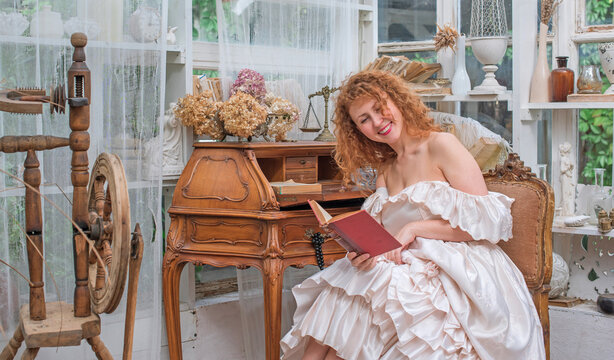 Romantic Victorian Woman Reading an Old Book. Perfect for concepts of reading, women&rsquo;s fiction, classic literature, imagination and book lovers