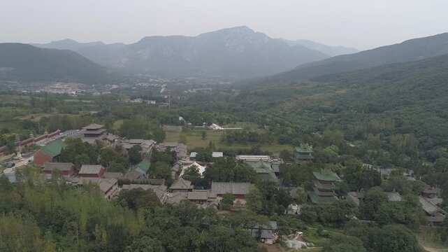 Raw footage of Aerial drone view of  Shaolin temple in Henan Province, China, Asia. Pagoda Forest at Shaolin Temple in China Asia. Shaolin Monastery from drone.