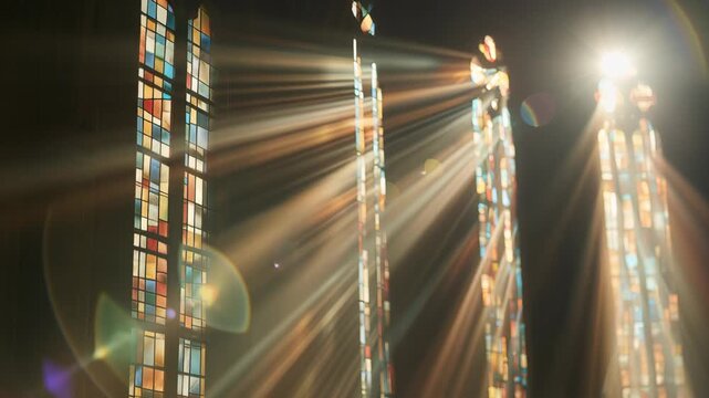 Light streaming through stained glass windows in a historic church