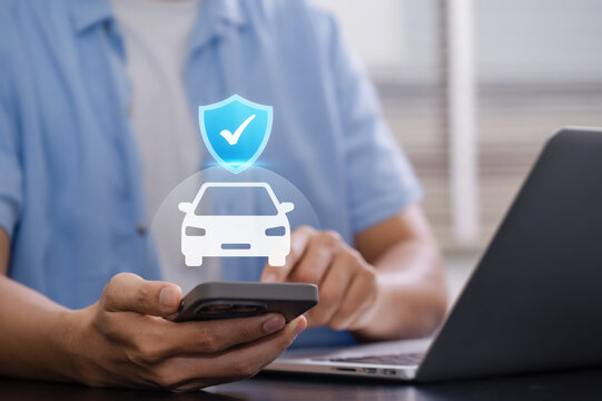 Car insurance digital service with customer using smartphone and laptop, vehicle protection shield interface representing online coverage, policy management and secure automotive protection