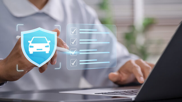 Vehicle insurance verification and policy management with&nbsp;professional reviewing digital car coverage checklist, protection requirements and insurance policy using laptop