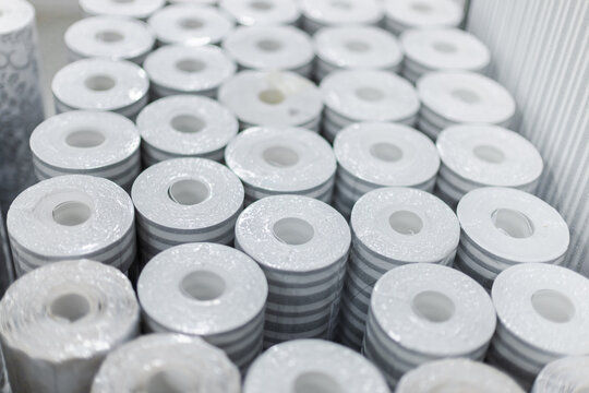 Stacked Decorative Wallpaper Rolls in Home Improvement Store