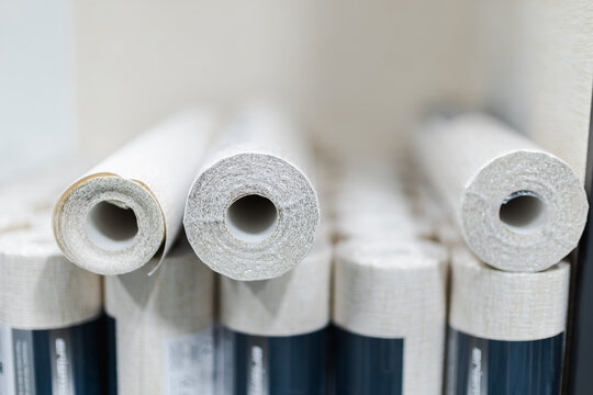 Close-up of wallpaper rolls in a home improvement store