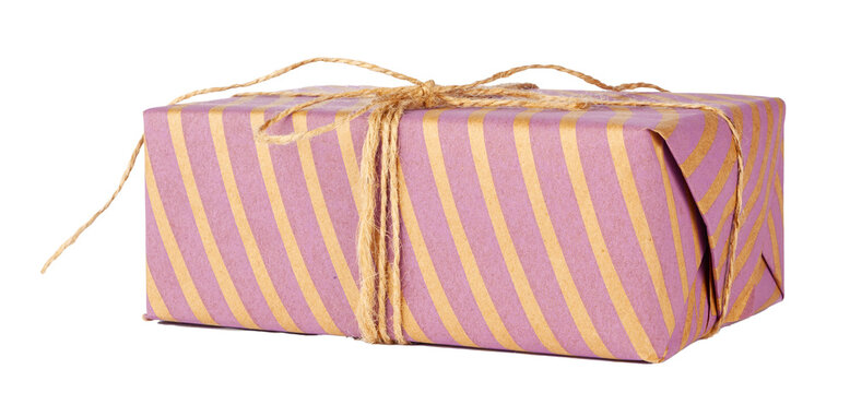 Gift box wrapped in purple paper with golden stripes and tied with twine string