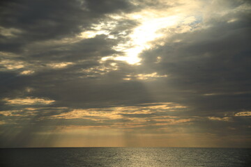 Fototapeta premium Sunbeams Breaking Through Clouds over the Sea of Japan