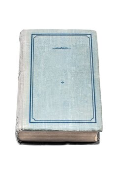 Well-worn, blue cloth-covered book with a simple decorative border, resting closed on its spine. The aged texture suggests a history of use.