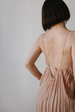 Back View of Woman in Elegant Pink Dress