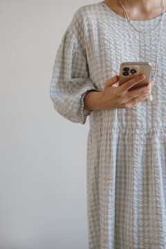 Casual Outfit with Smartphone in Hand