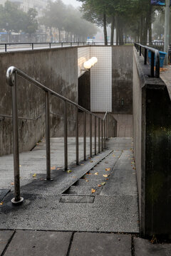 Stockholm, Sweden  An outdoor pedestrian ramp on a staircase for baby prams and handicapped wheelchairs to an underground passage.