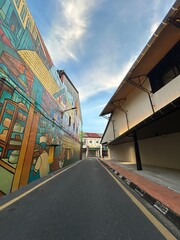 Empty urban street with vibrant street art © SonyaMarv