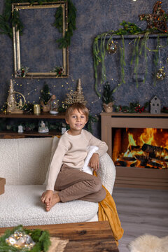 Happy child on Christmas, enjoying some quality time, opening presents, kids on Christmas eve in decorated home