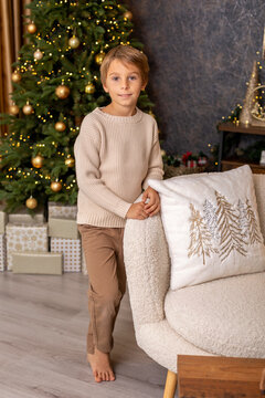 Happy child on Christmas, enjoying some quality time, opening presents, kids on Christmas eve in decorated home