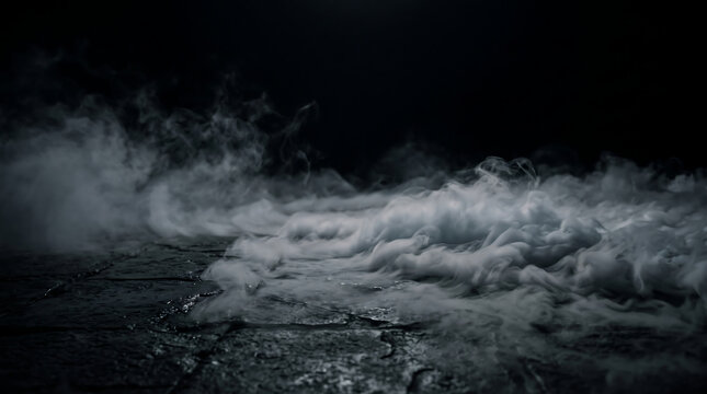 Ground fog creeping across a dark textured floor