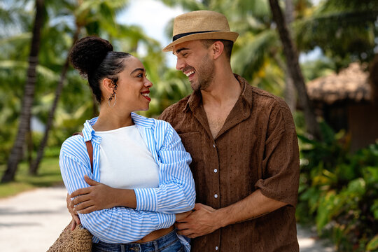 High-quality atmospheric portrait of a happy couple in a tropical resort setting on vacation