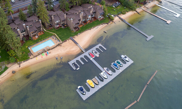 High-angle shot of waterfront properties and moored boats