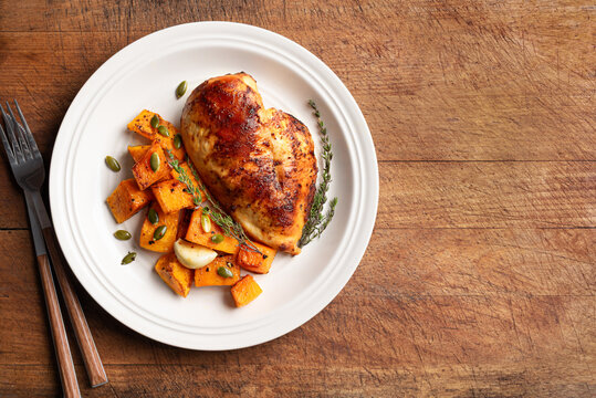 Autumn meal: roasted chicken with pumpkin and herbs